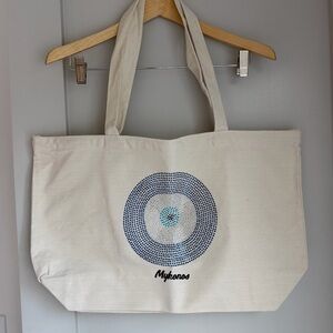 Cream Tote Bag with beaded “evil eye”and the printed word “Mykonos” Never worn